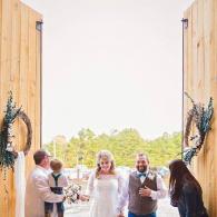 Bride and Groom Entering Barn 