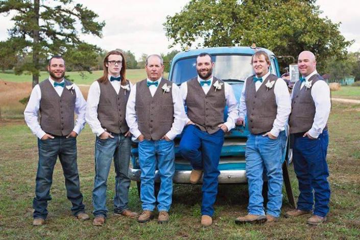 These groomsmen depict a stylish, rustic appeal posing in front our antique truck! 