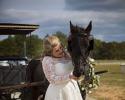 There are so many unique photo opportunities here at Triple H Barn as seen with this bride posing with a majestic horse. 