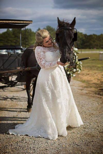 There are so many unique photo opportunities here at Triple H Barn as seen with this bride posing with a majestic horse. 